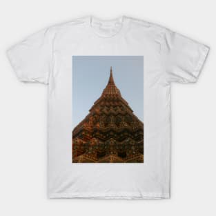 First low angle view of a Buddha stupa reaching symmetrical in the clear sky. T-Shirt